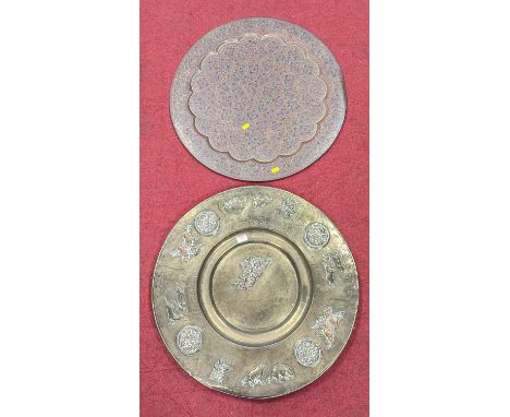 An Indian copper tray, decorated in high relief with floral roundels and hunting scenes, with further engraved decoration thr