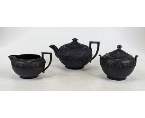 A Wedgwood and Prinknash matched three-piece tea service, relief decorated with classical figures and foliage