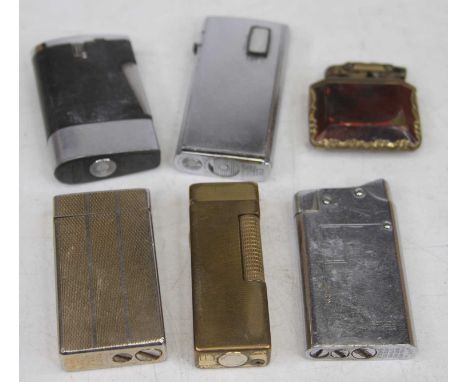 A collection of cigarette lighters to include Dunhill gilt metal example, having all-over engine turned decoration and Colibr