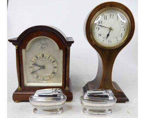 An Edwardian walnut and boxwood strung mantel clock, of balloon shape, the enamel dial having Arabic markers, h.26cm; togethe