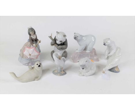 A Lladro porcelain figure of a lady holding an umbrella, h.19cm; together with three Lladro figures of polar bears, a Lladro 