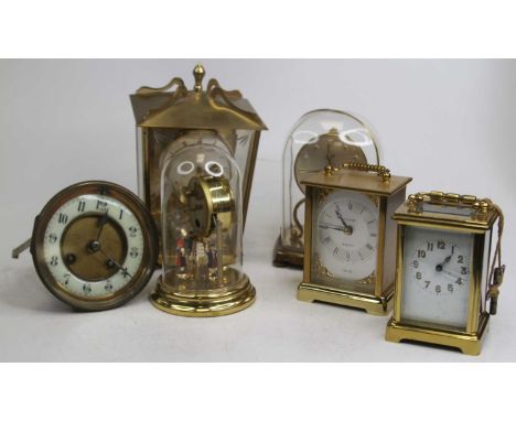 A 20th century German anniversary clock, under perspex dome, h.15cm; together with another, two carriage clocks, a four-glass
