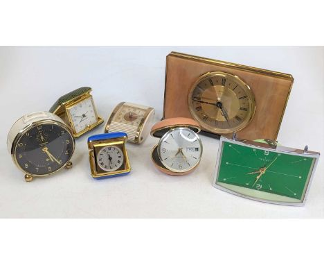 A collection of vintage mantel and travel clocks 