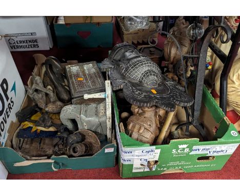 Two boxes of miscellaneous items, to include wood carvings and a wrought iron table candlestick 