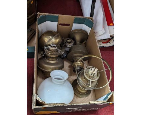 A collection of oil lamp parts 