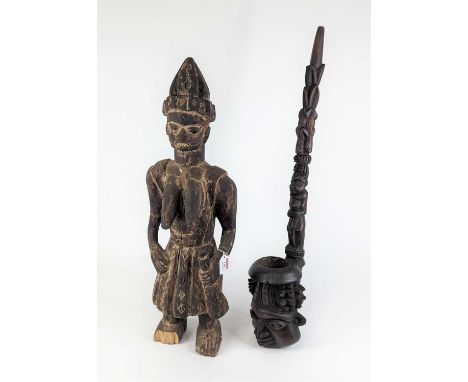 An African carved softwood fertility figure, possibly Benin, h.72cm (a/f); together with an African carved hardwood pipe, the