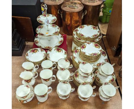 A collection of Royal Albert Old Country Roses pattern table wares to include dinner plates, side plates, cake stand, coffee 