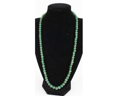 A beaded nephrite necklace, 58cm; together with a pair of vintage carved jade ear pendants on 14ct yellow gold screw-back fit