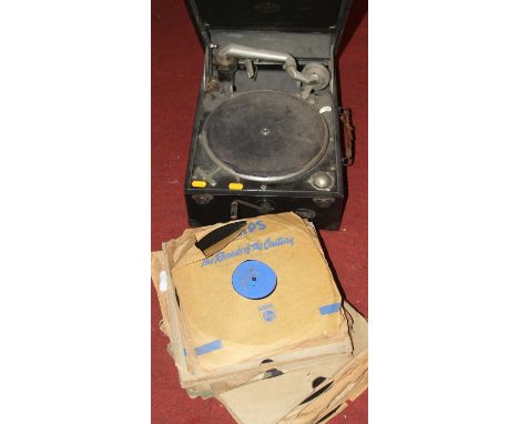 A vintage Columbia portable gramophone; together with a collection of records 