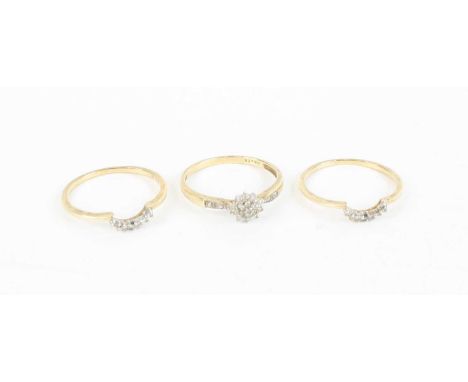 A matching set of three 9ct gold and diamond point set rings, having centre flower head cluster and matching outer rings, tot