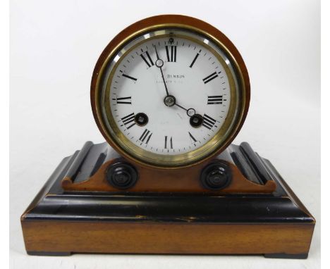 A 19th century walnut and ebonised mantel clock of drum head shape, the enameled dial signed JW Benson and having Roman numer