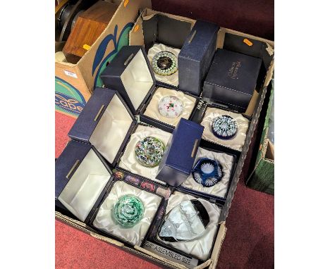 A collection of Caithness glass paperweights, to include an aquarium example; together with various collectors guidesNo appar