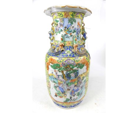A Chinese Canton porcelain vase, enamel decorated with a battle scene, h.35cm (a/f)Several large chips to rim.Approx. 14cm cr
