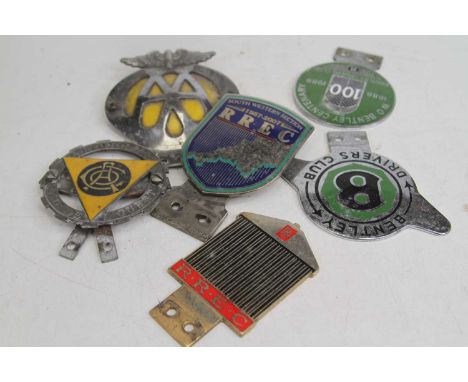 A W.O. Bentley Centenary 1888-1988 Bentley Drivers Club enamel car badge, dia. 7cm; together with four other car badges to in