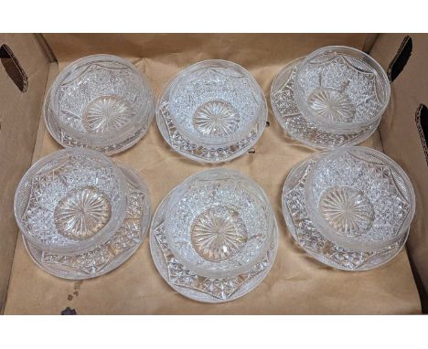 A set of six cut glass bowls and saucers