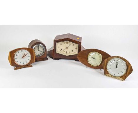 An Art Deco walnut cased mantel clock of geometric shape, having brushed silvered dial with applied Arabic markers, h.19cm; t