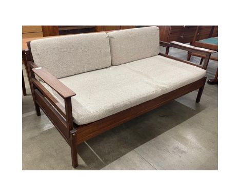 A Guy Rogers Gambit afromosia sofa/daybed.&nbsp;Please note this lot is being sold as a work of art. It may not comply with t