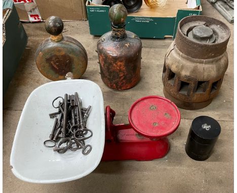A cartwheel hub, two leather covered bottles, scales and assorted antique keys