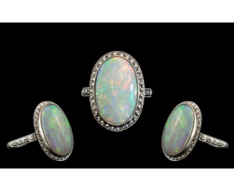 Antique Platinum Superb Opal Set Dress Ring, marked Platinum to interior of shank. The large oval shaped opal of excellent co