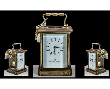 A Brass Carriage Clock white dial with Roman numerals marked Matthew Norman