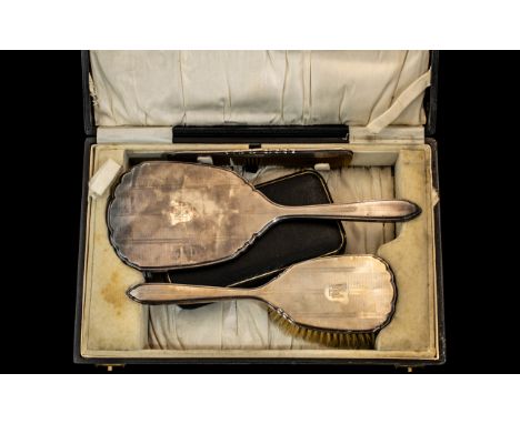 A Boxed Dressing Table Set, silver backed comb, mirror and brush, in a silk lined case, together with two silver sauce spoons