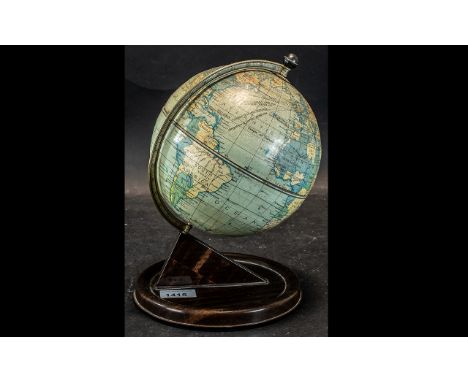 A Mid 20th Century 7" Terrestrial Globe on Stand,  made of tin.