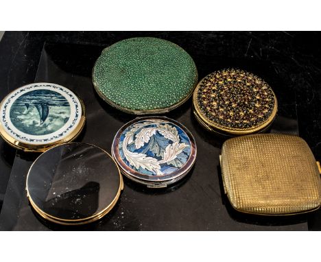 Collection of Vintage Powder Compacts, including Stratton brass base, enamel green and white leaf design, with silver surroun