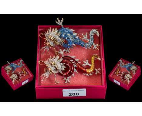 Butler &amp; Wilson - Two Dragon Brooches, comprising a dragon brooch with blue crystals, body gold tone, together with a red