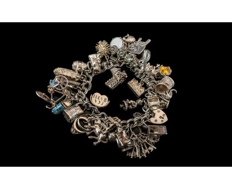 Excellent Vintage Sterling Silver Charm Bracelet Loaded with ( 31 ) Good Charms. All Marked for Sterling Silver. Comprises En
