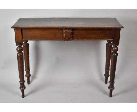 A Late 19th Century Mahogany Console Table with Turned Tapered Supports having Central Shield Mount and Side Store Drawer, 10