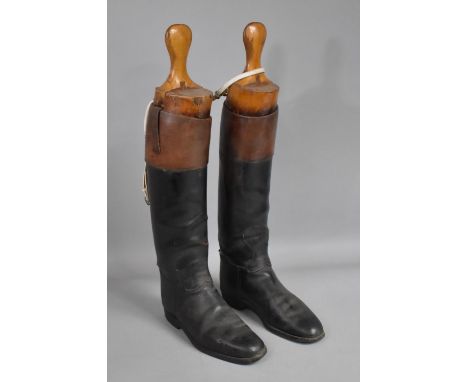 A Pair of Vintage&nbsp;Gentlemen's Riding Boots complete with Wooden Trees, Black Leather having Brown Tops, 29cms Long Foot,