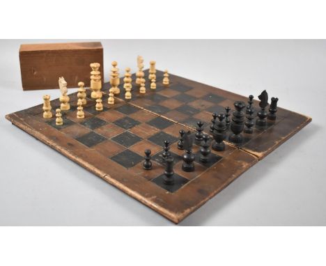 A Vintage Travelling Chess Board Together with Wooden Pieces 