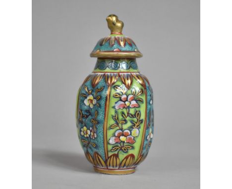 A 19th Century Chinese Porcelain Clobbered Lidded Six Sided Vase, the Sections Decorated in a Floral Motif in Alternating Gre