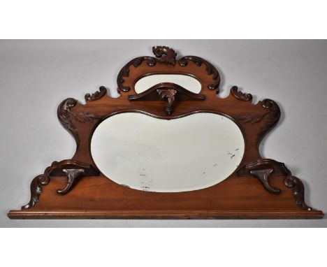 A Late Victorian Mahogany Over Mantel Mirror having Two Sectioned Kidney Shaped Mirrors Flanked by Two Shelves, Larger Mirror