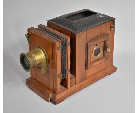 A Late 19th Century Mahogany Magic Lantern Complete with Brass Lens, and with Loss, 22.5cms High 