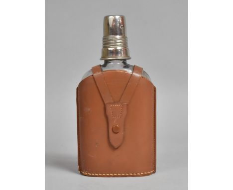 A 20th Century Leather Mounted Glass Flask with Silver Plated Spirit Measure Top, 19cms High 