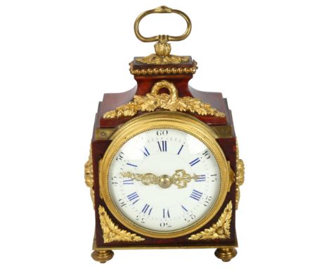 A 19th century tortoiseshell and ormolu-mounted travelling clock, with enamel dial and 8-day movement striking on a gong, hei