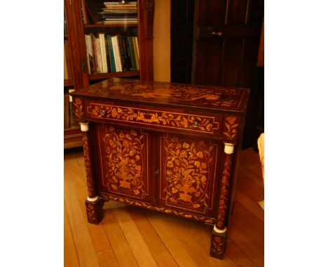 A 19th century Dutch marquetry inlaid walnut sideboard, the top decorated with flowing basket of flowers, single frieze drawe