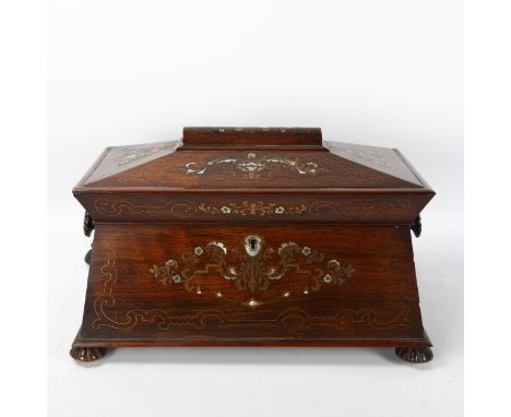 A 19th century rosewood sarcophagus-shaped tea caddy, with inlaid brass and mother-of-pearl marquetry decoration and wooden i