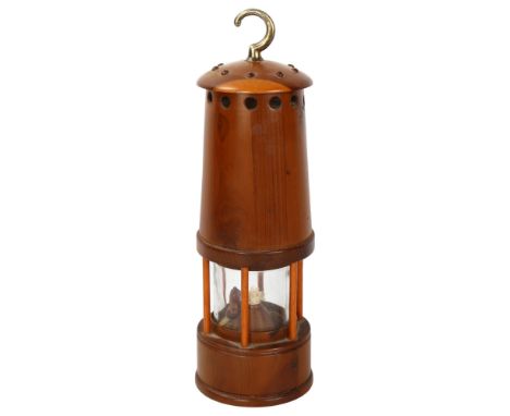 An unusual yew wood miner's lamp, height excluding handle 23cmGood condition 