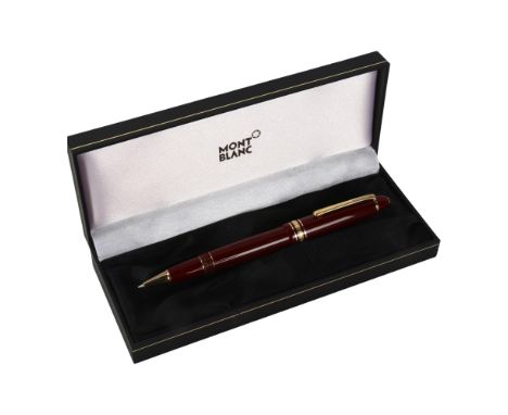 A Mont Blanc Meisterstuck ballpoint pen with burgundy and gold metal body, box and service guideGood condition, needs new car