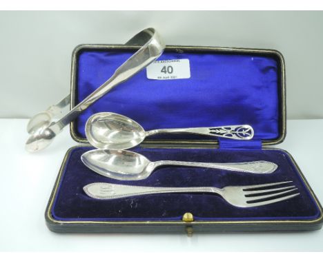 A cased child's HM silver spoon and fork bearing monogram to terminals, an HM silver artisan silver spoon having pierced deco