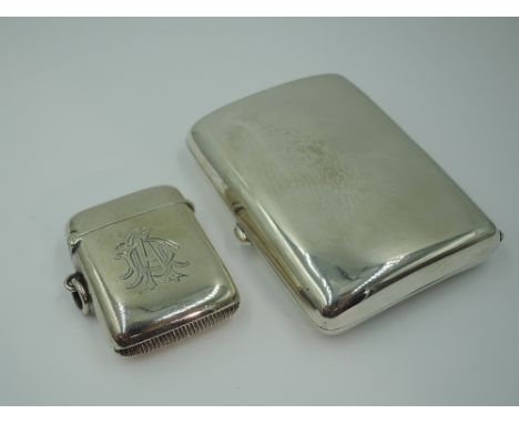 An Edwardian silver cigarette case of plain form, Chester 1903, William Neale, with presentation card inside from V.A Hospita