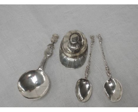 A silver caddy spoon in the form of a jockey's cap, Sheffield 1912, Thomas Bradbury &amp; Sons Ltd, another silver caddy spoo