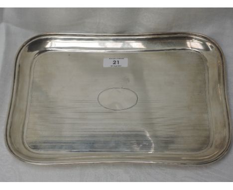 An HM silver dressing table tray having raised rim and engine turned stripe decoration and plain cartouche, hallmarks worn, m