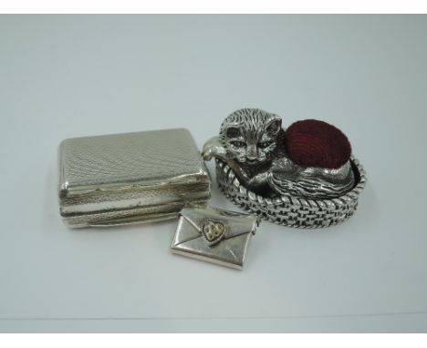 A modern HM silver pin cushion in the form of a cat in her basket, Sheffield Assay office, a small silver snuff box having en