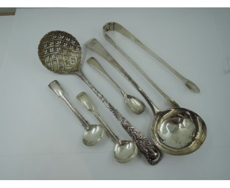 A selection of Georgian silver flatware including an ornately decorated sauce ladle, London 1778, a plain sauce ladle, London