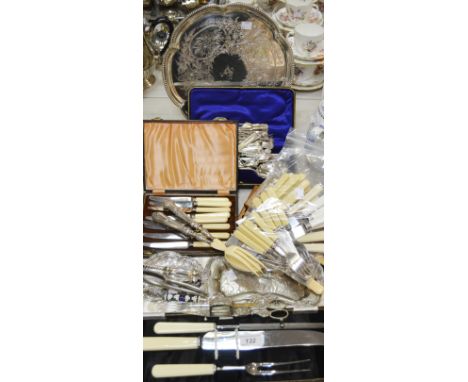 A silver plated tray beaded border; salad servers; fish servers; candle snuffer and tray; nut crackers; teaspoons; other flat