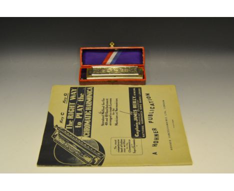 A Hohner super chromatic harmonica, original box and instructions