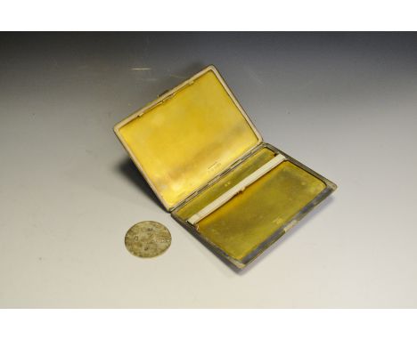 A silver engine turned cigarette case Mappin and Webb Birmingham 1939  159.7g; a silver fob Sheffield 1976, 7.0g